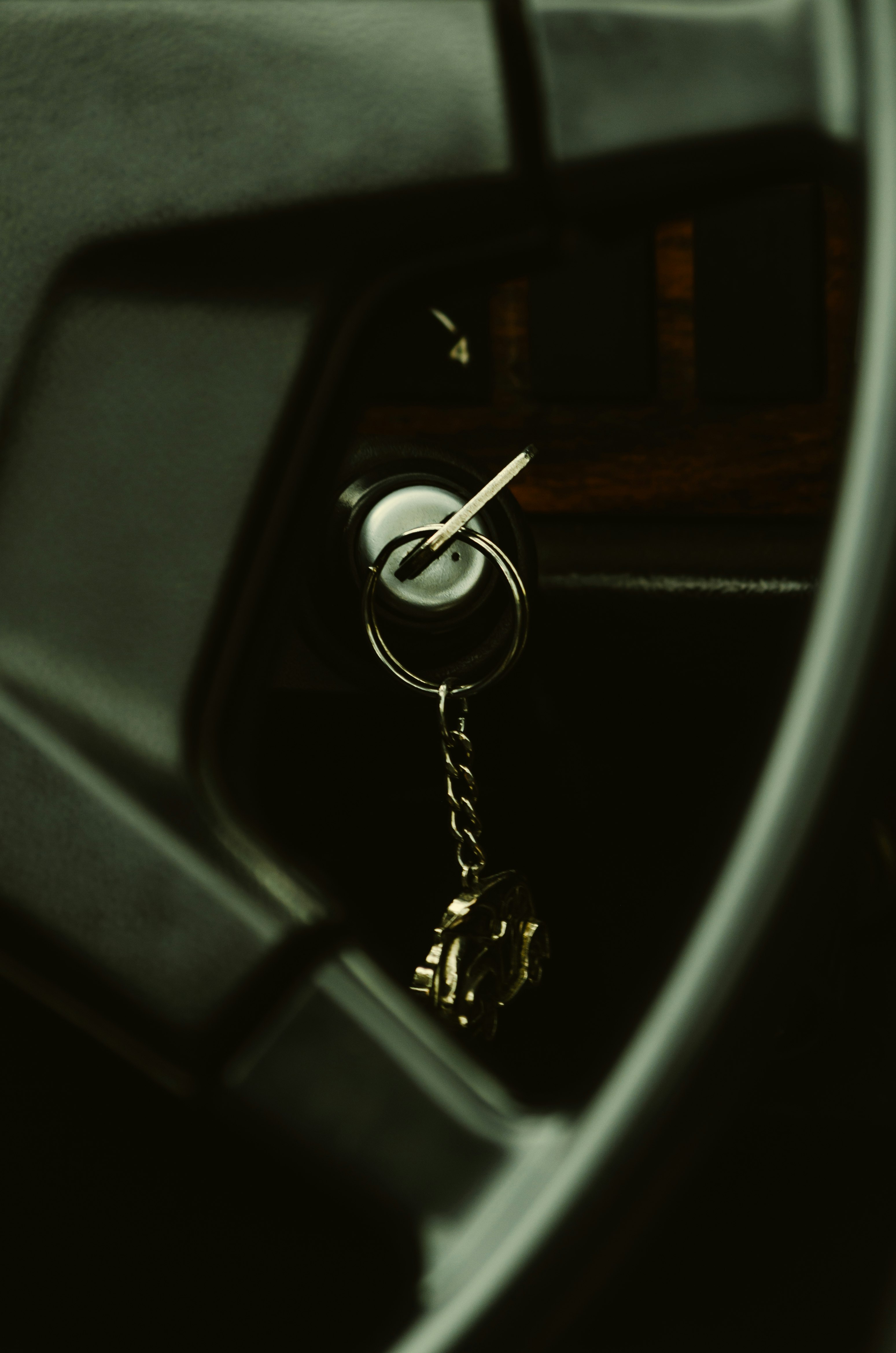 black car steering wheel with silver padlock
